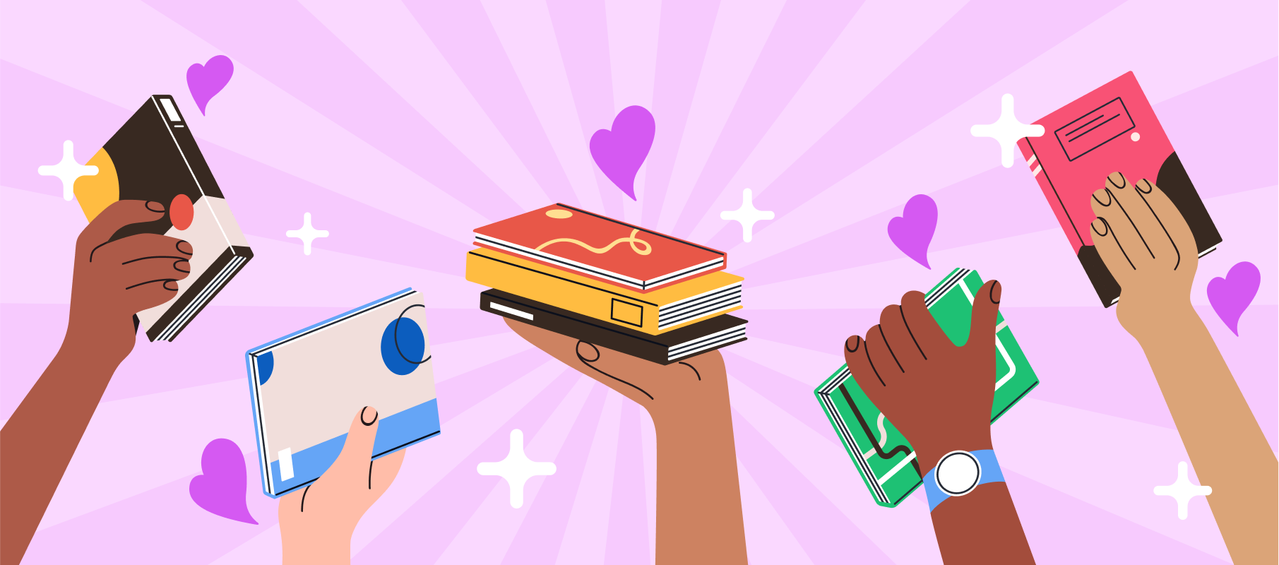 Hands holding books in celebration.