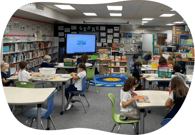 School media center with elementary students reading