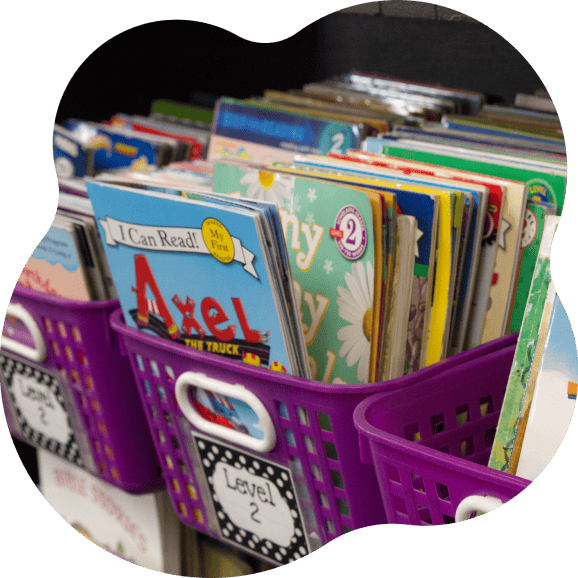 Purple kindergarten classroom book bin sorted by reading level